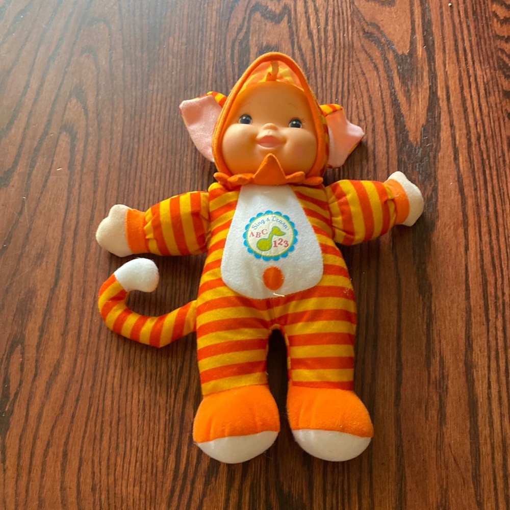 Orange and yellow doll to learn ABCs
